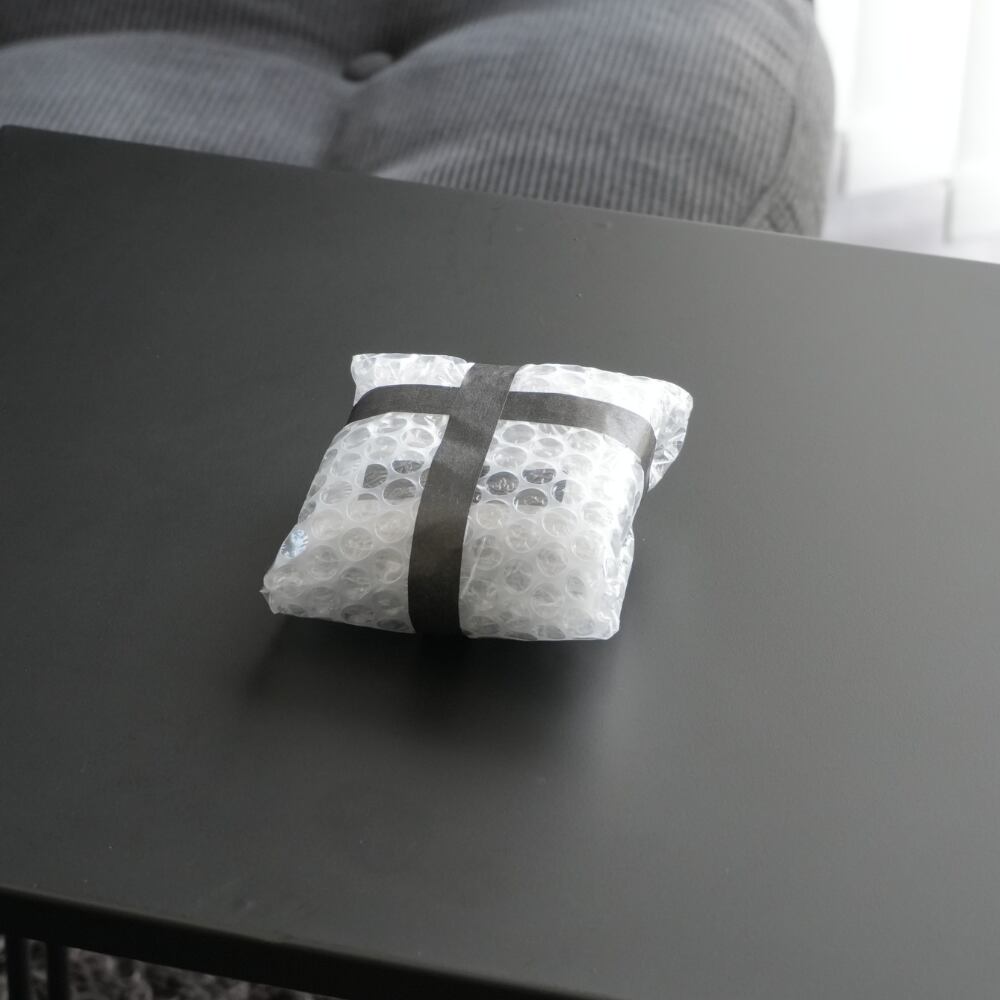 梱包材でトレイを保護（２回）