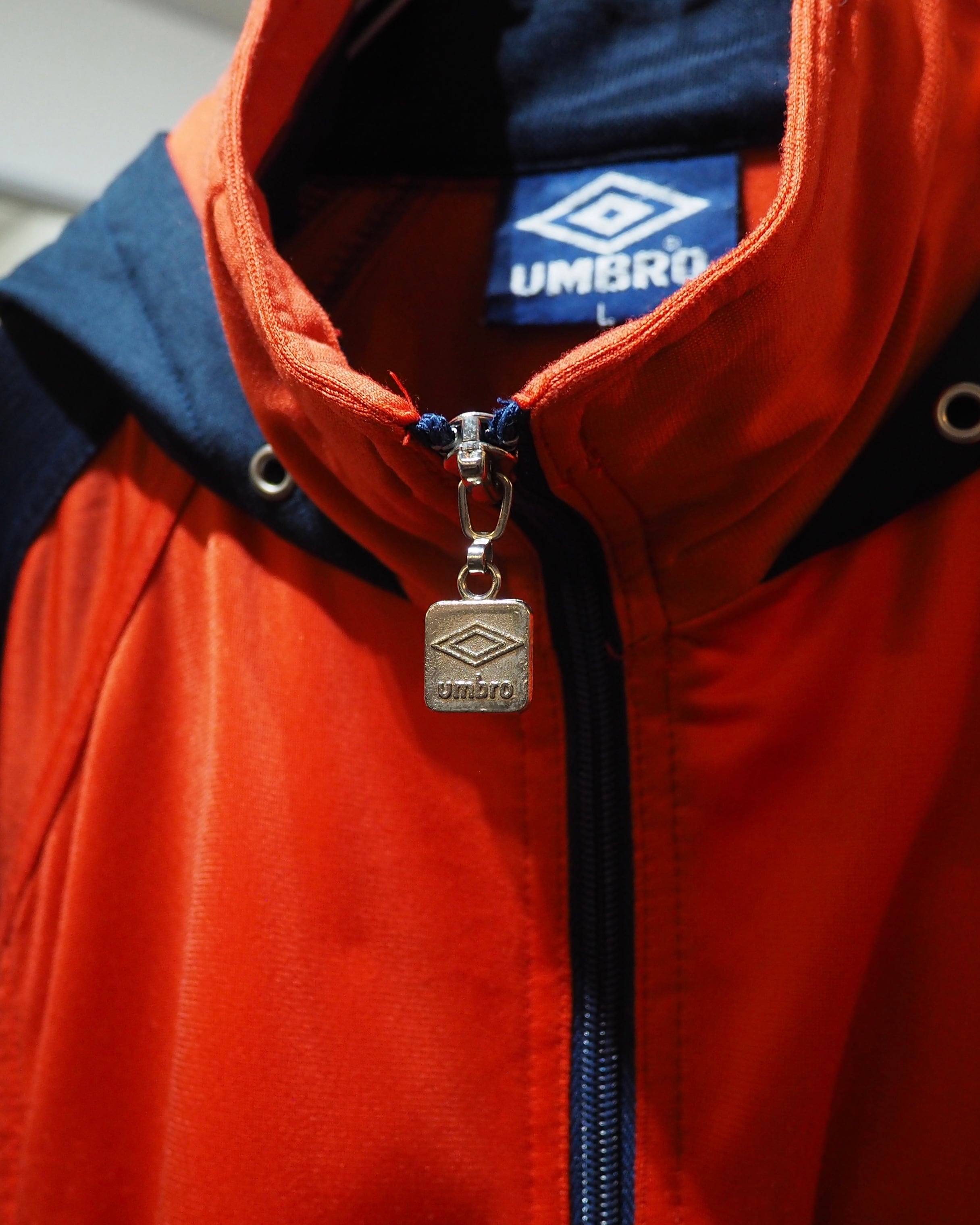 1990s " UMBRO " Vivid Orange × Dark Navy Switching Panel Vintage Loose Track Jacket