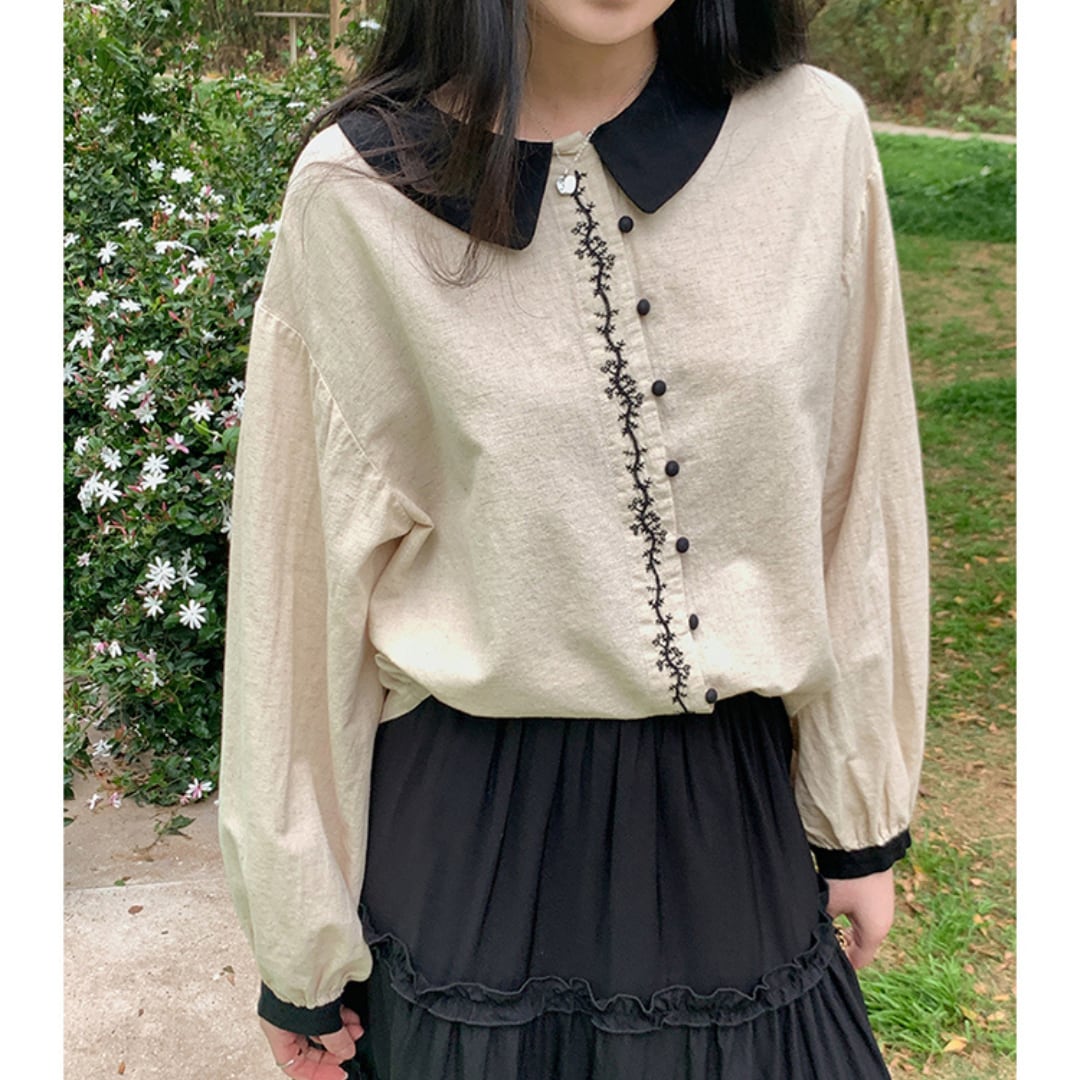 black collar embroidered white top