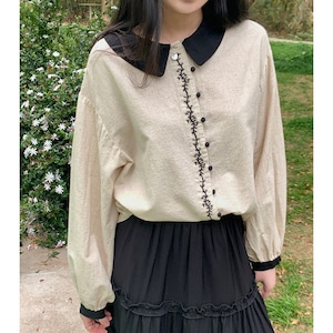 black collar embroidered white top