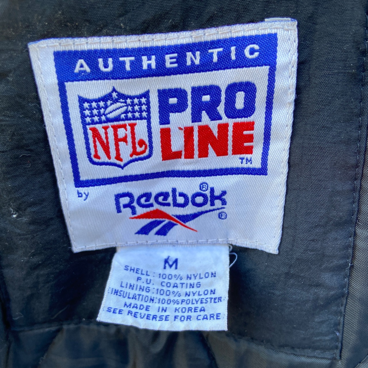 Reebok リーボック NFLカロライナ・パンサーズ チームロゴ刺繍 中綿 