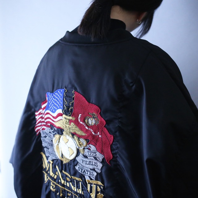 multi embroidered patch design over silhouette type MA-1 bomber jacket