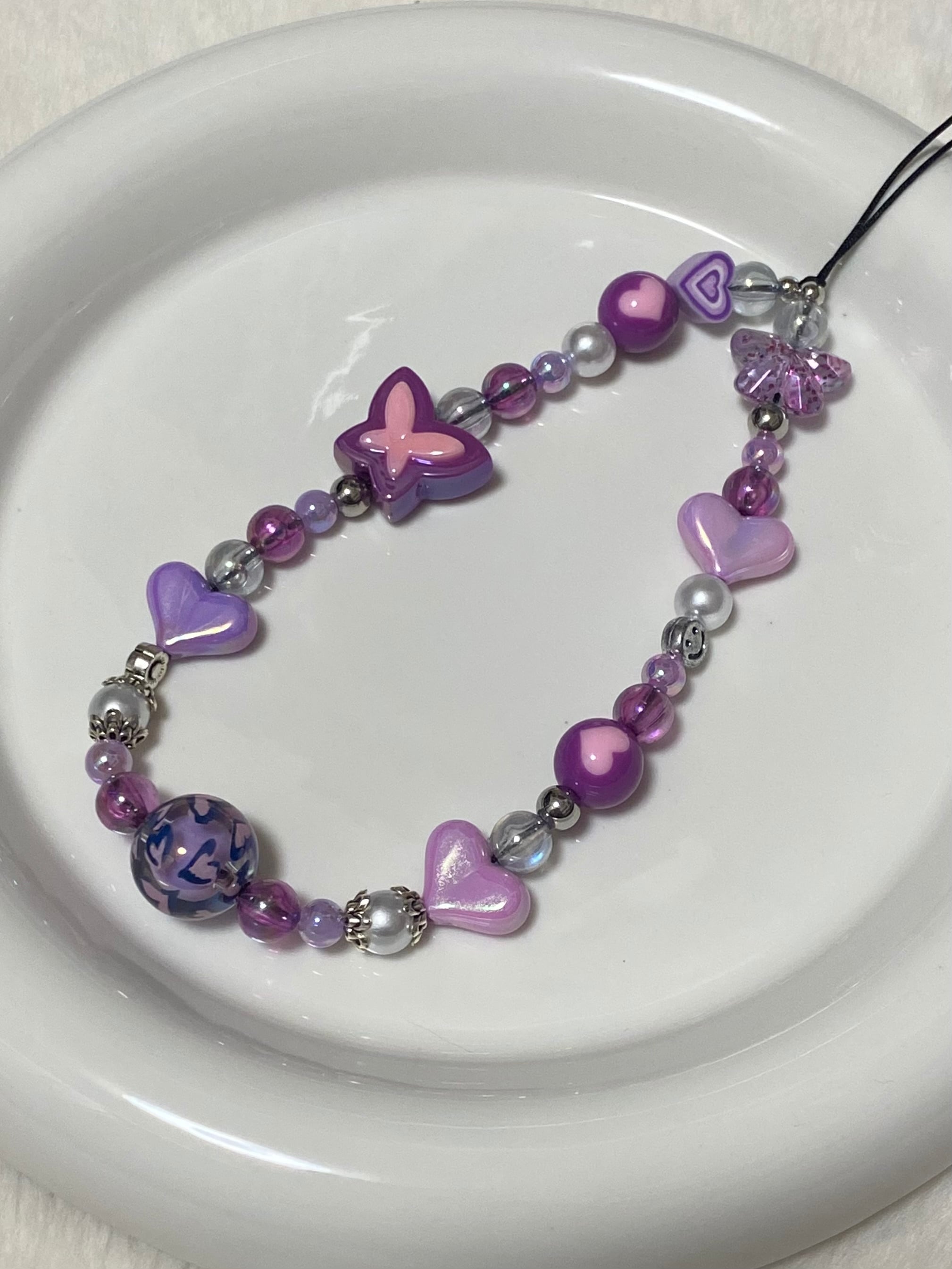 57.アイヌ模様のペンダント、ストラップ使用のパーツ、1種類10個