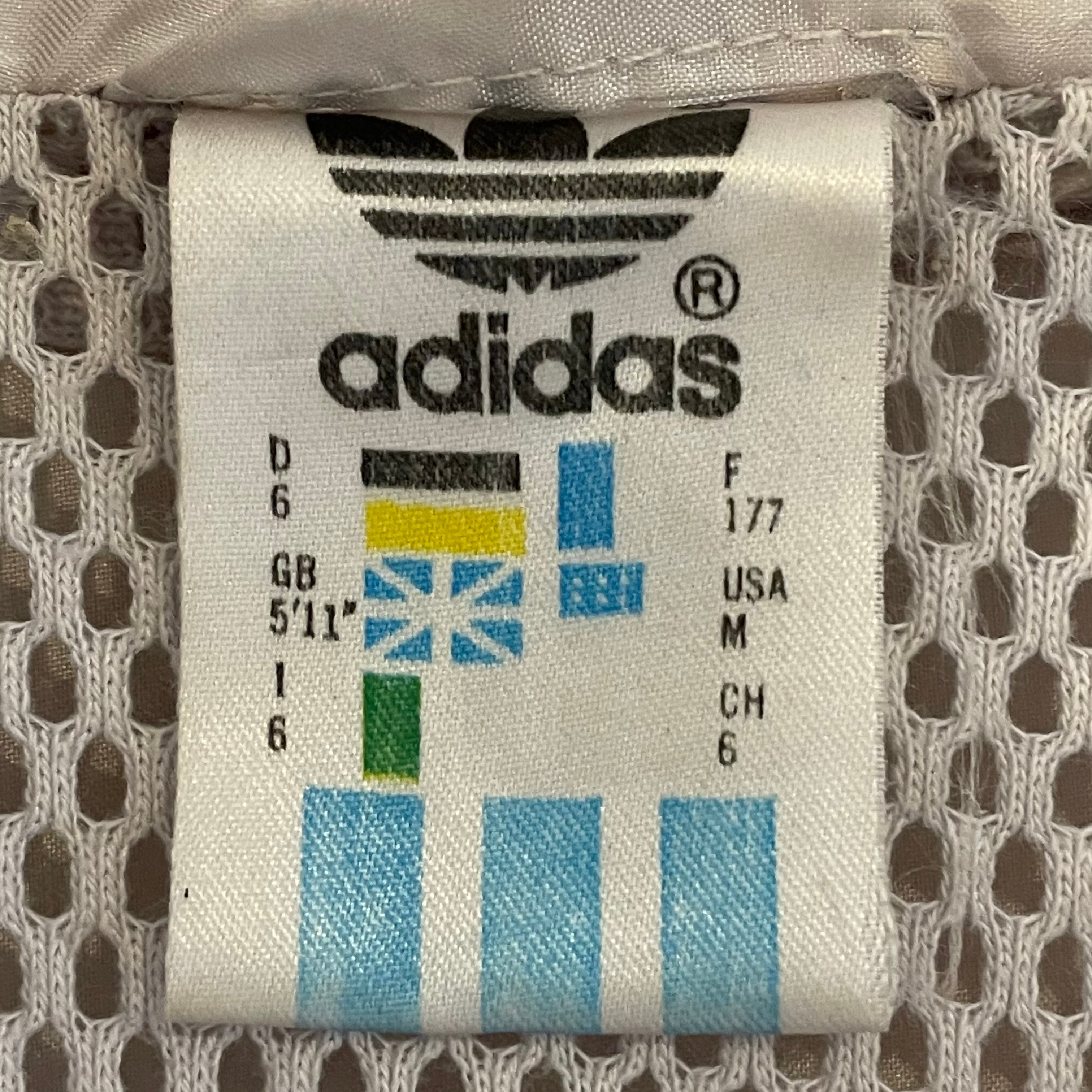 adidas トラックパンツ　国旗タグ　水色