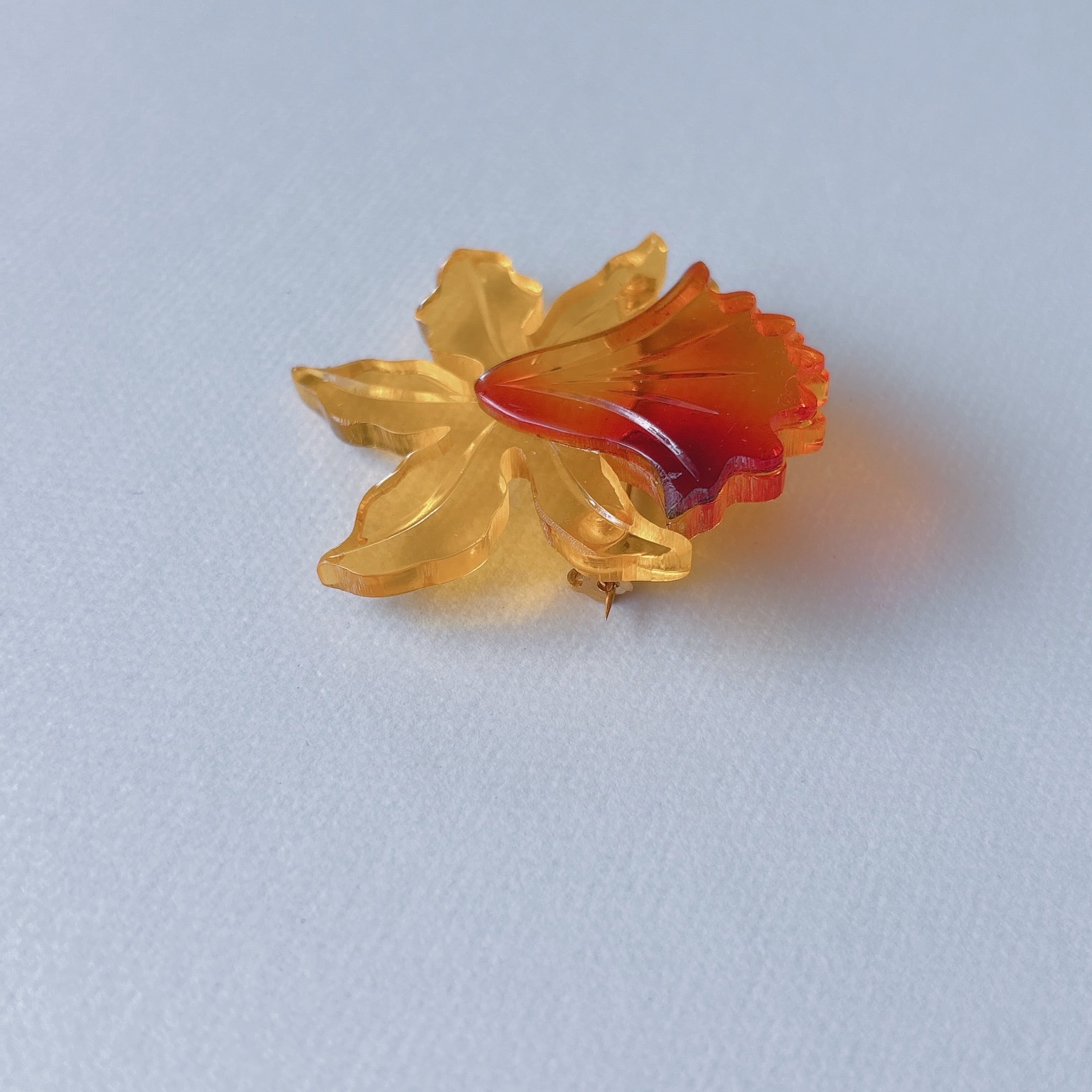Vintage yellow orange amber acrylic plastic flower cattleya brooch