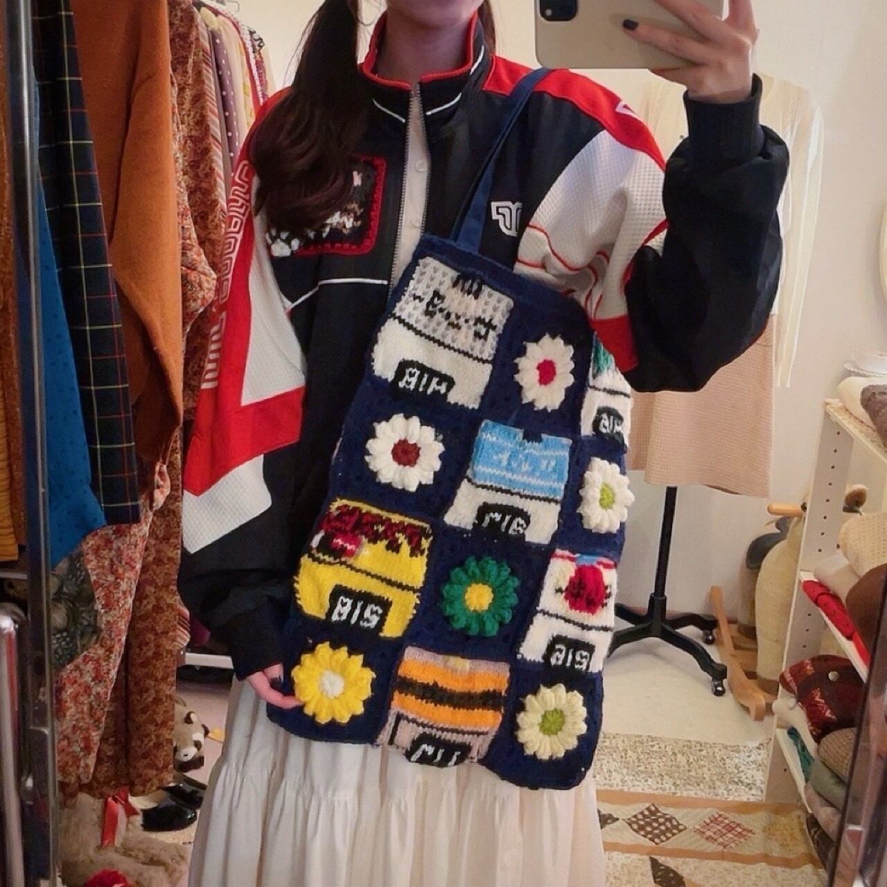 original / cigarette display rack knit tote bag