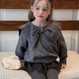 秋蝶結びカラーセーター