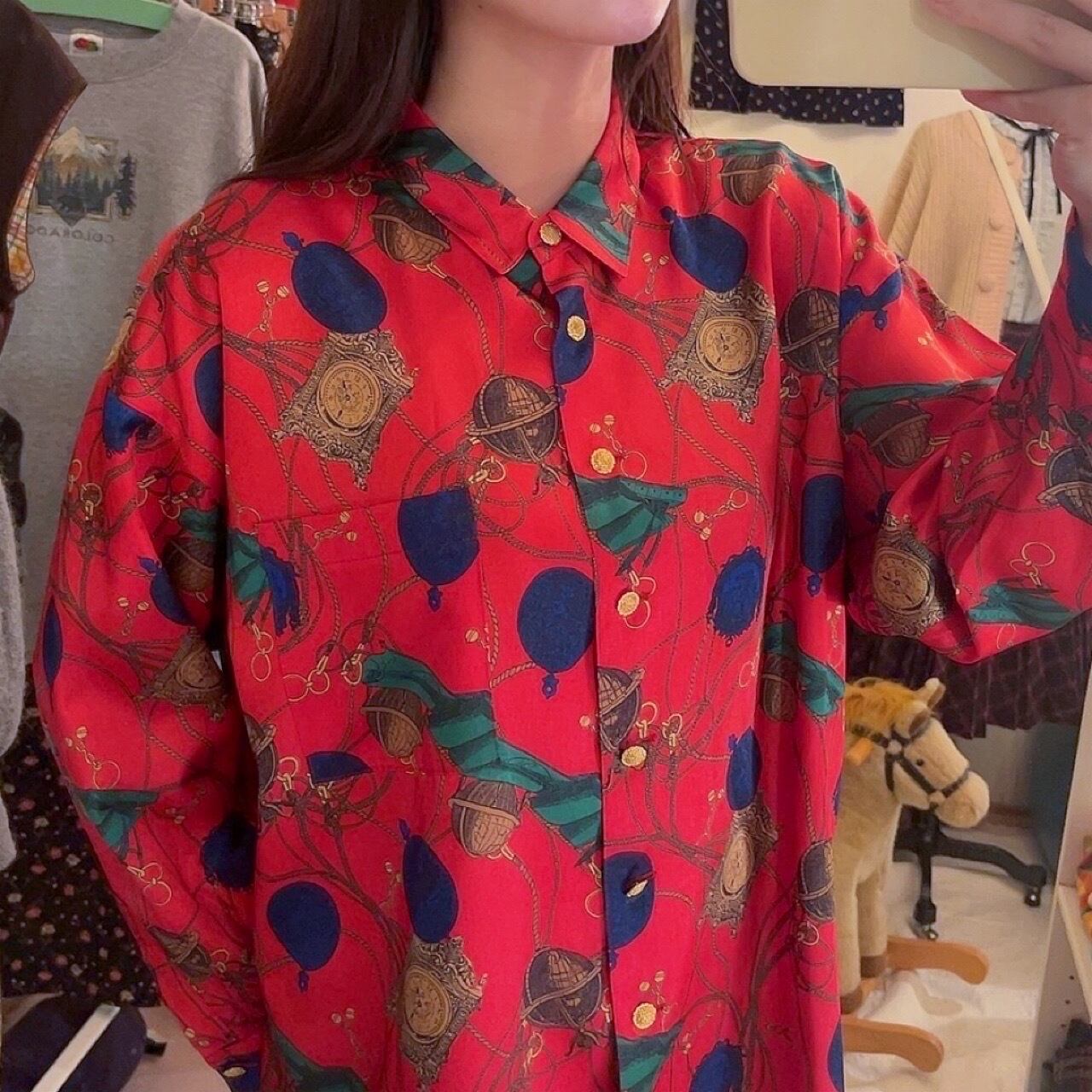 clock and globe red satin blouse