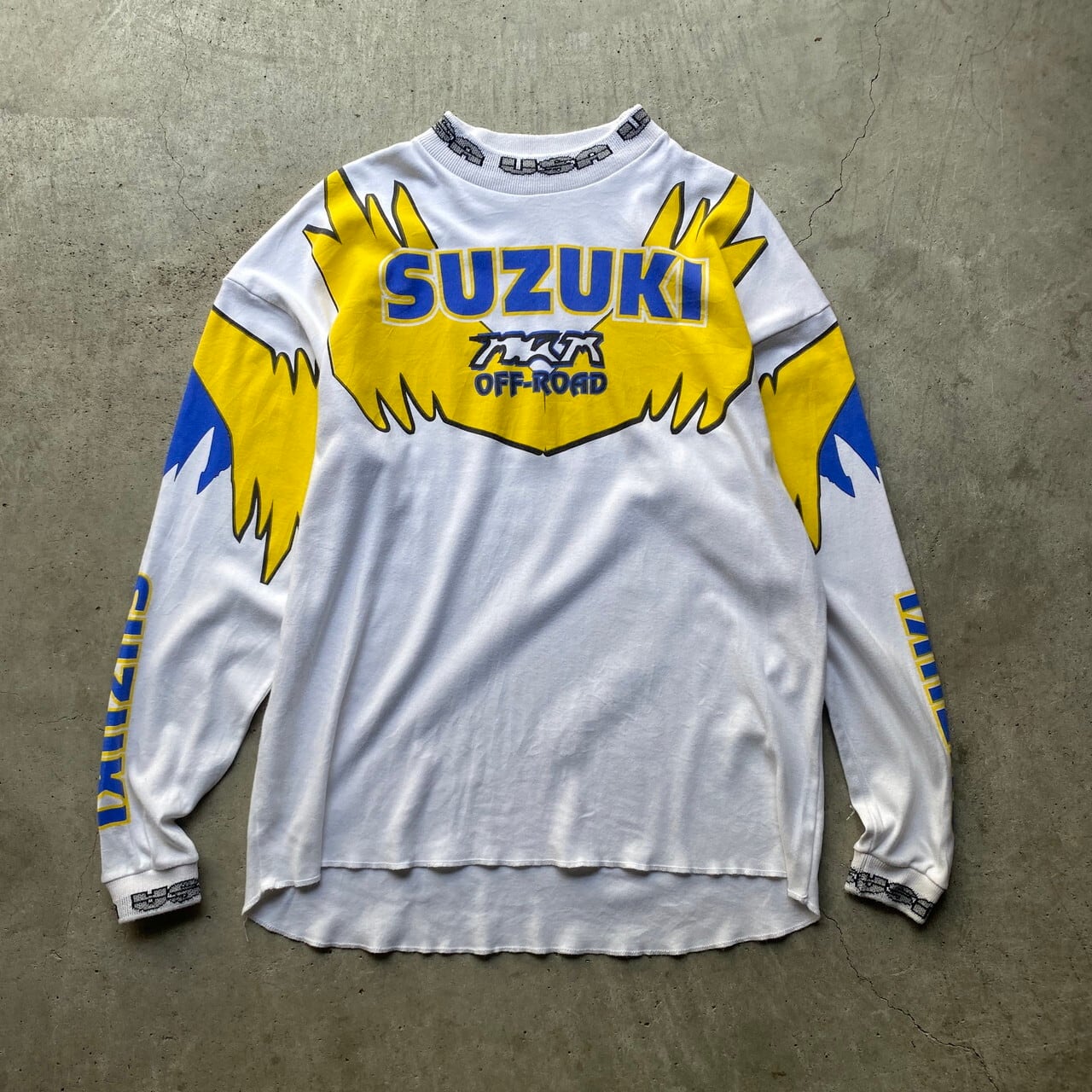 80年代 80s SUZUKI スズキ USA ロゴ プリント モトクロス レーシング ロングTシャツ バイク モーターサイクルTシャツ ヴィンテージ  ビンテージ 袖プリ エルボーパッチ モックネック メンズL 古着【ロングＴシャツ】 | cave 古着屋【公式】古着通販サイト