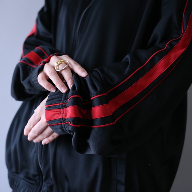 "NIKE" black × red over silhouette track jacket