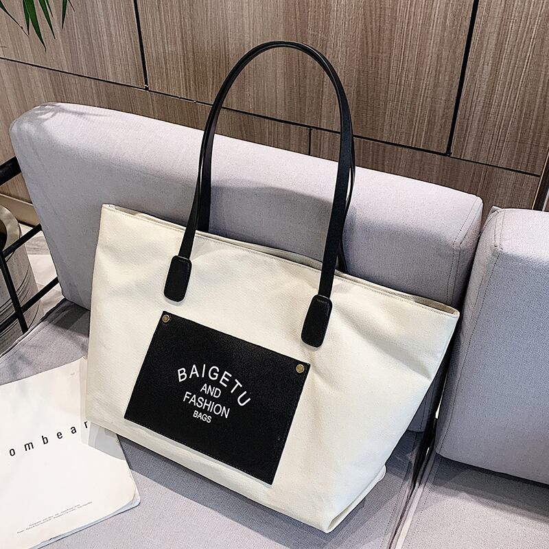 シンプルな大容量バッグハンドバッグ2020新しいトレンディなファッションワンショルダーポータブルキャンバスバッグネットレッドワイルドトートバッグ Tiancai_Wing_Bag65317043426