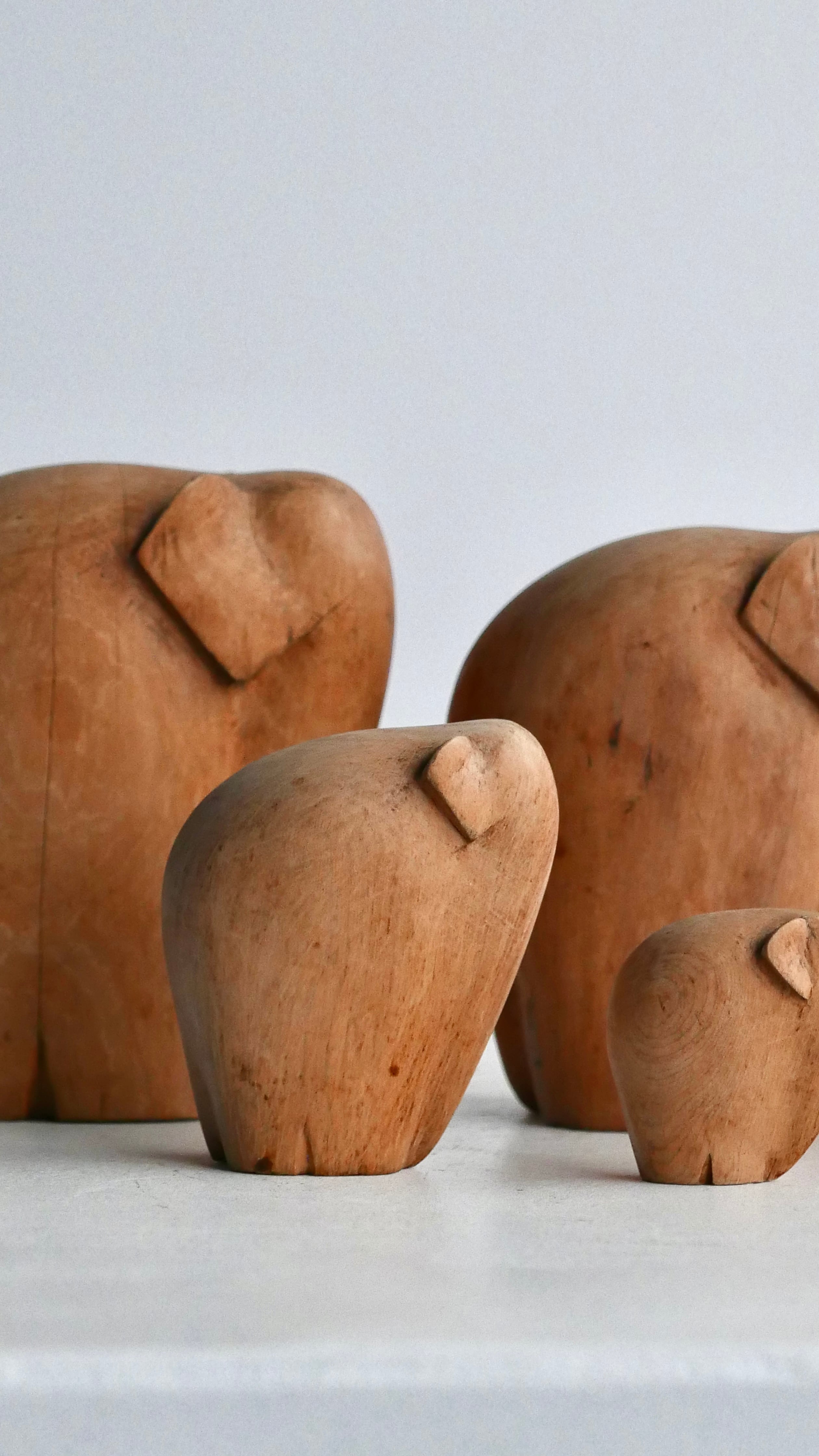 old wood carving , elephant family , minimal detail