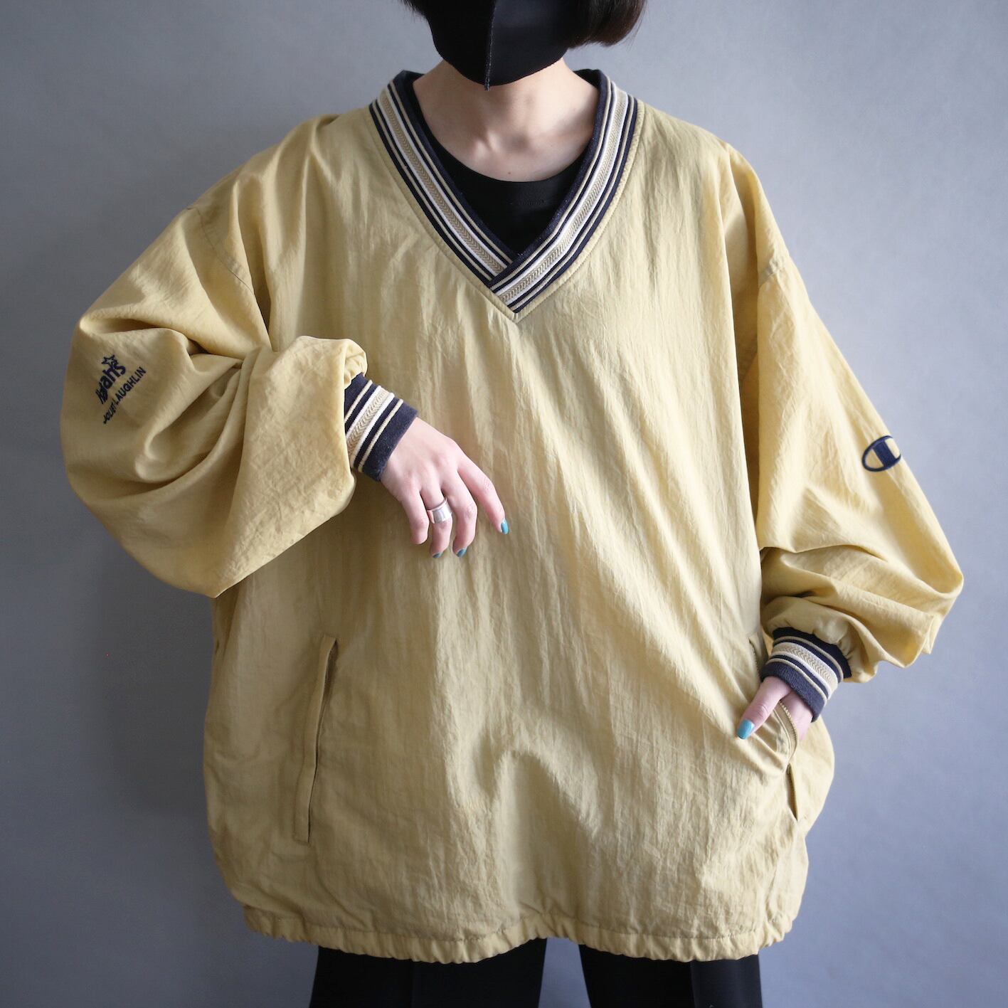"Champion" knit rib design over silhouette yellow nylon pullover