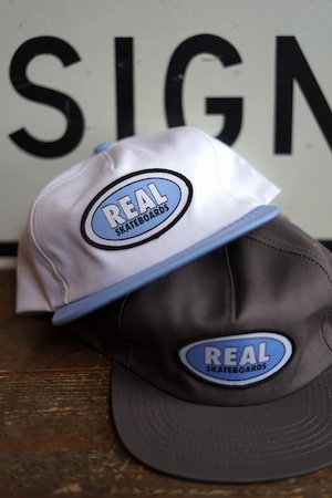 REAL " OVAL SNAPBACK CAP "