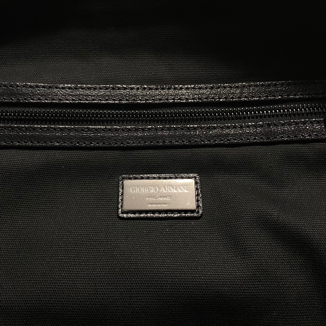GIORGIO ARMANI crack leather travel bag