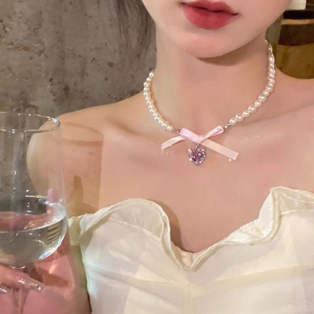 ユウジュエリーのピンクハート蝶結びネックレス
