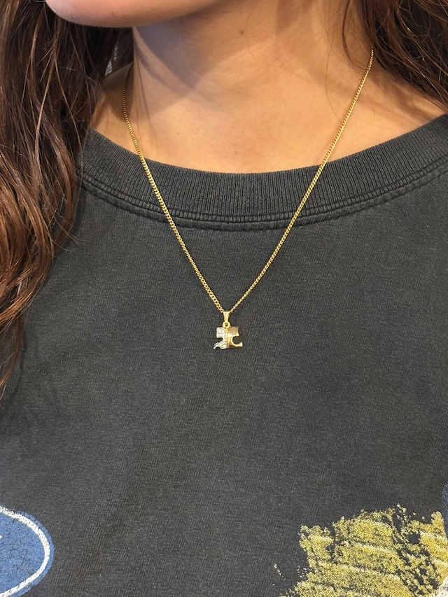 courrèges/ vintage gold×stone logo necklace.