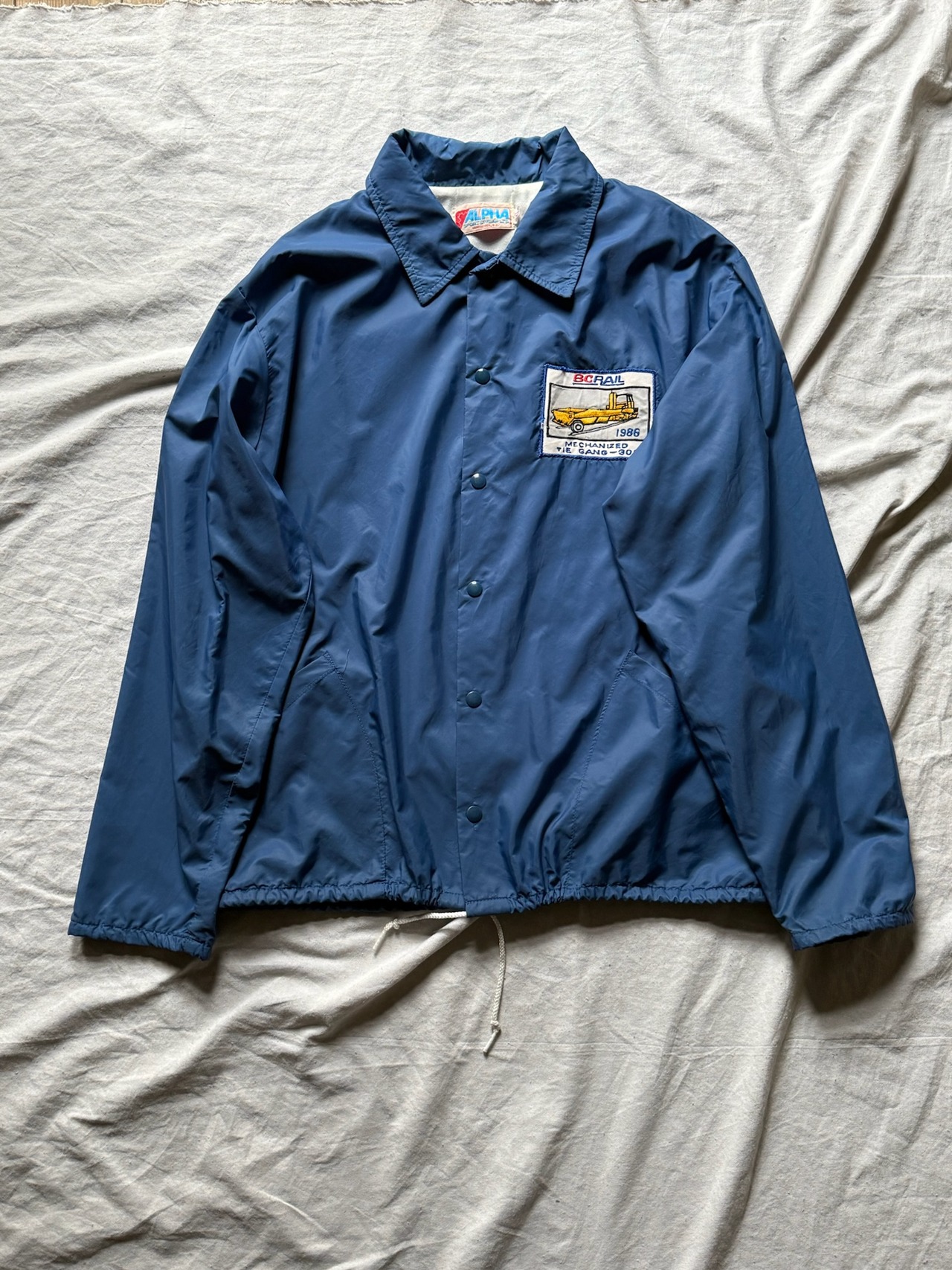Pale blue nylon coach jacket