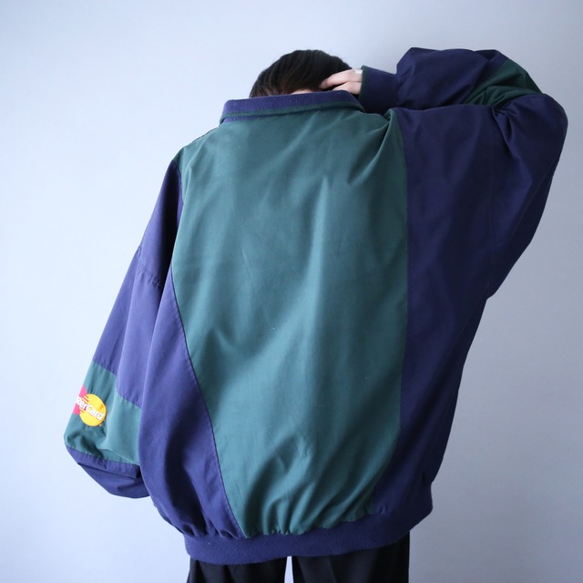 "Master Card" green × navy bi-color switching half-zip pullover