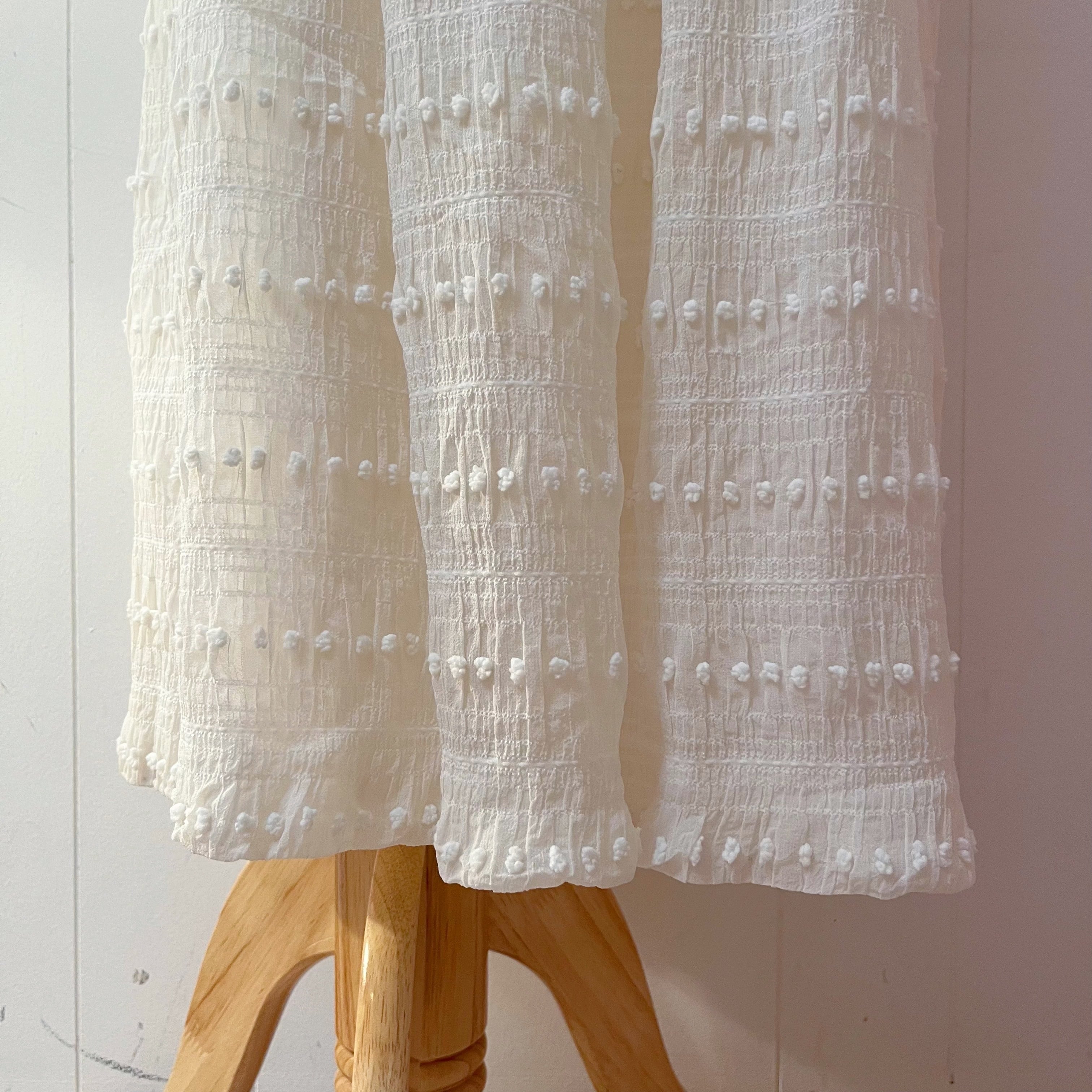 NINARICCI / mini ponpon white flare skirt