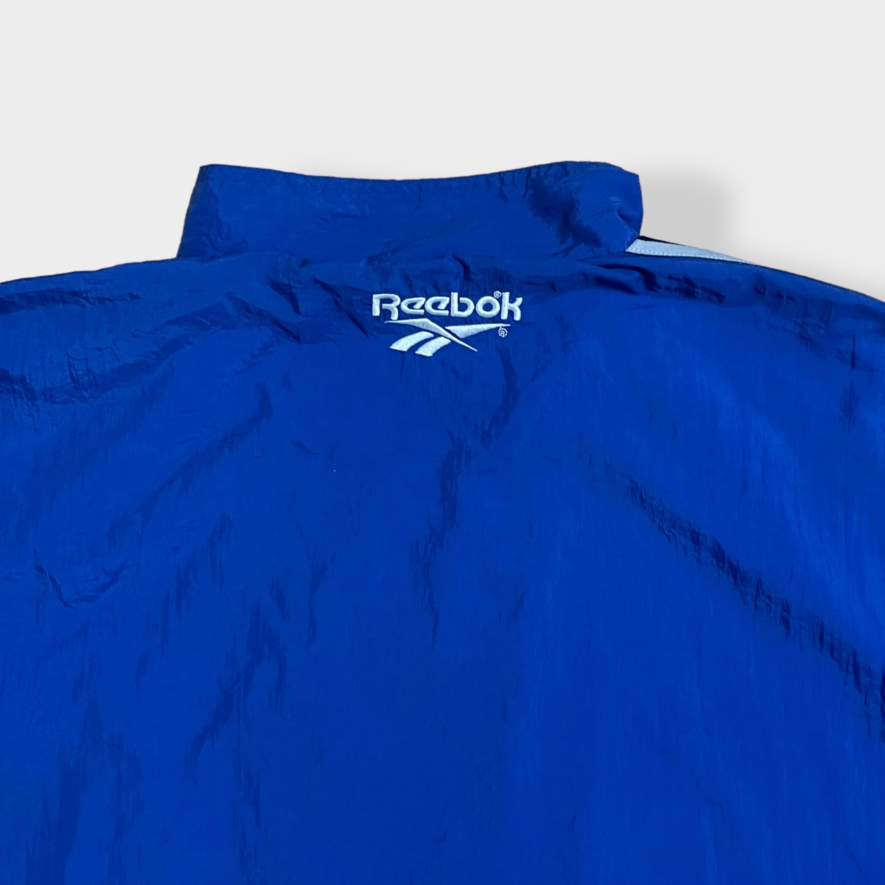 【Reebok】90s ナイロンジャケット ブルゾン 刺繍ロゴ フルジップ ジップアップ バックロゴ ワンポイント XL相当 ビッグサイズ リーボック ライトアウター 春 秋 us古着