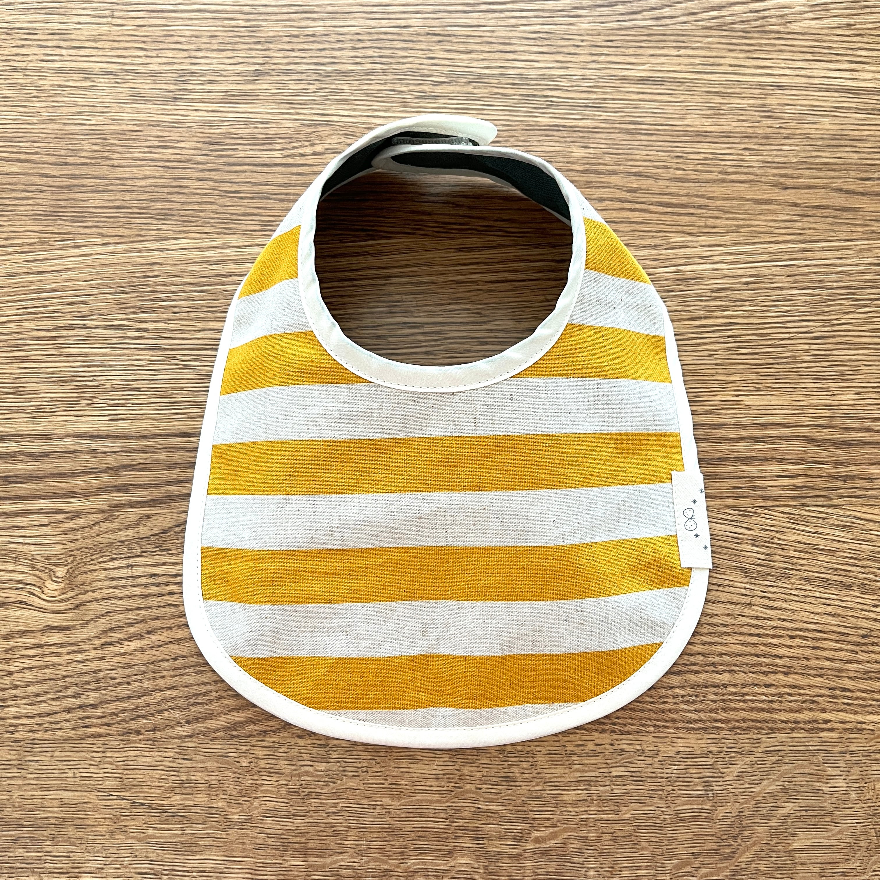 リバーシブルベビースタイ・黄色サークル柄 | baby ba-ba（ベビーバーバ）