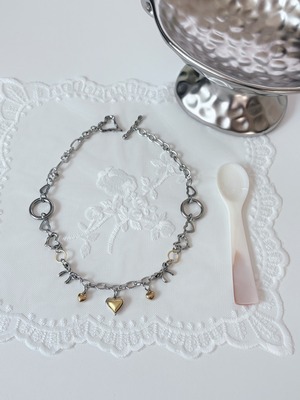 gold heart × silver necklace