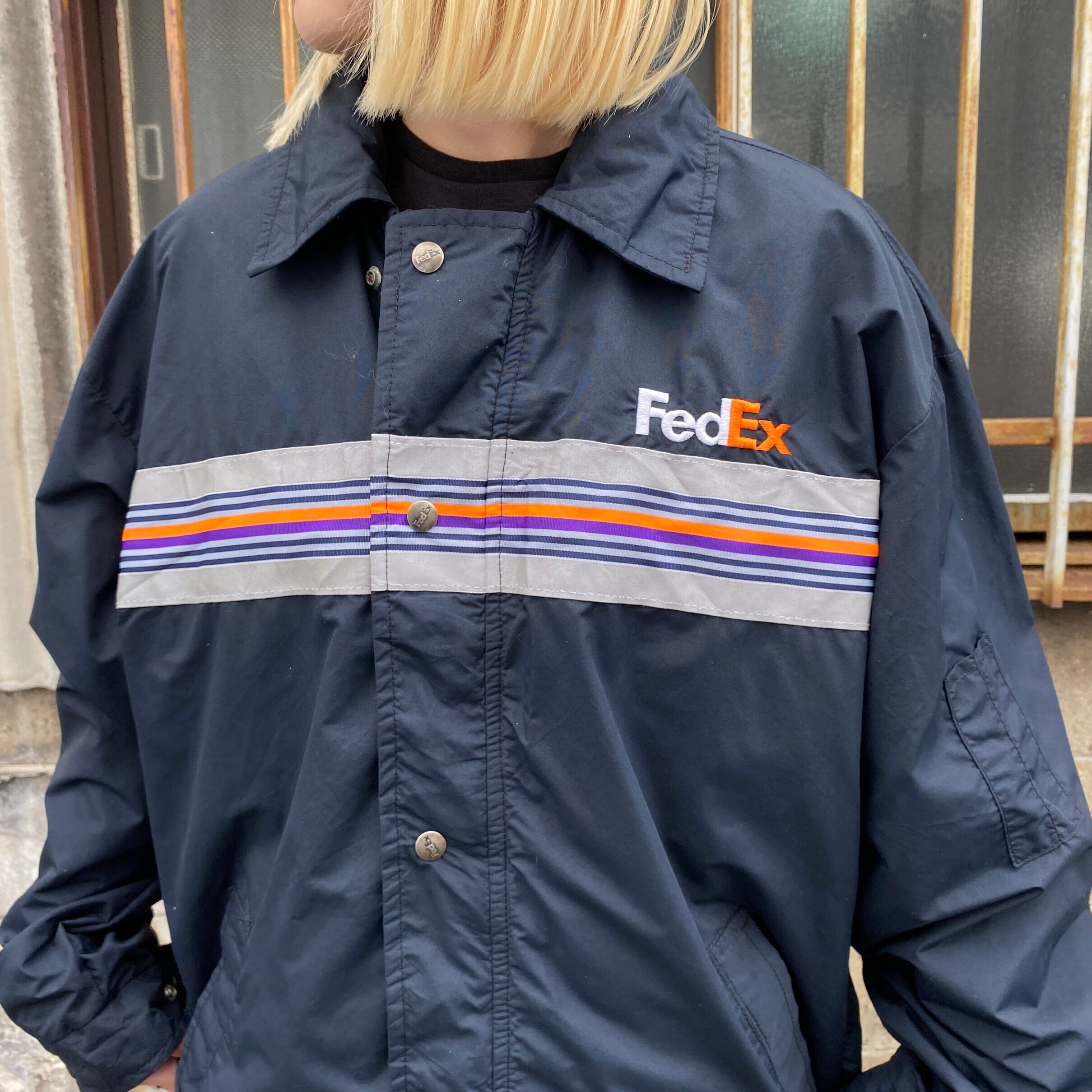 USA製 FedEx フェデックス 企業ロゴ刺繍 リフレクター フード収納型 ナイロン ワークジャケットメンズL相当 古着 ネイビー 紺 ヴィンテージ  ビンテージ ナイロンジャケット【ワークジャケット】【HA10】 | cave 古着屋【公式】古着通販サイト