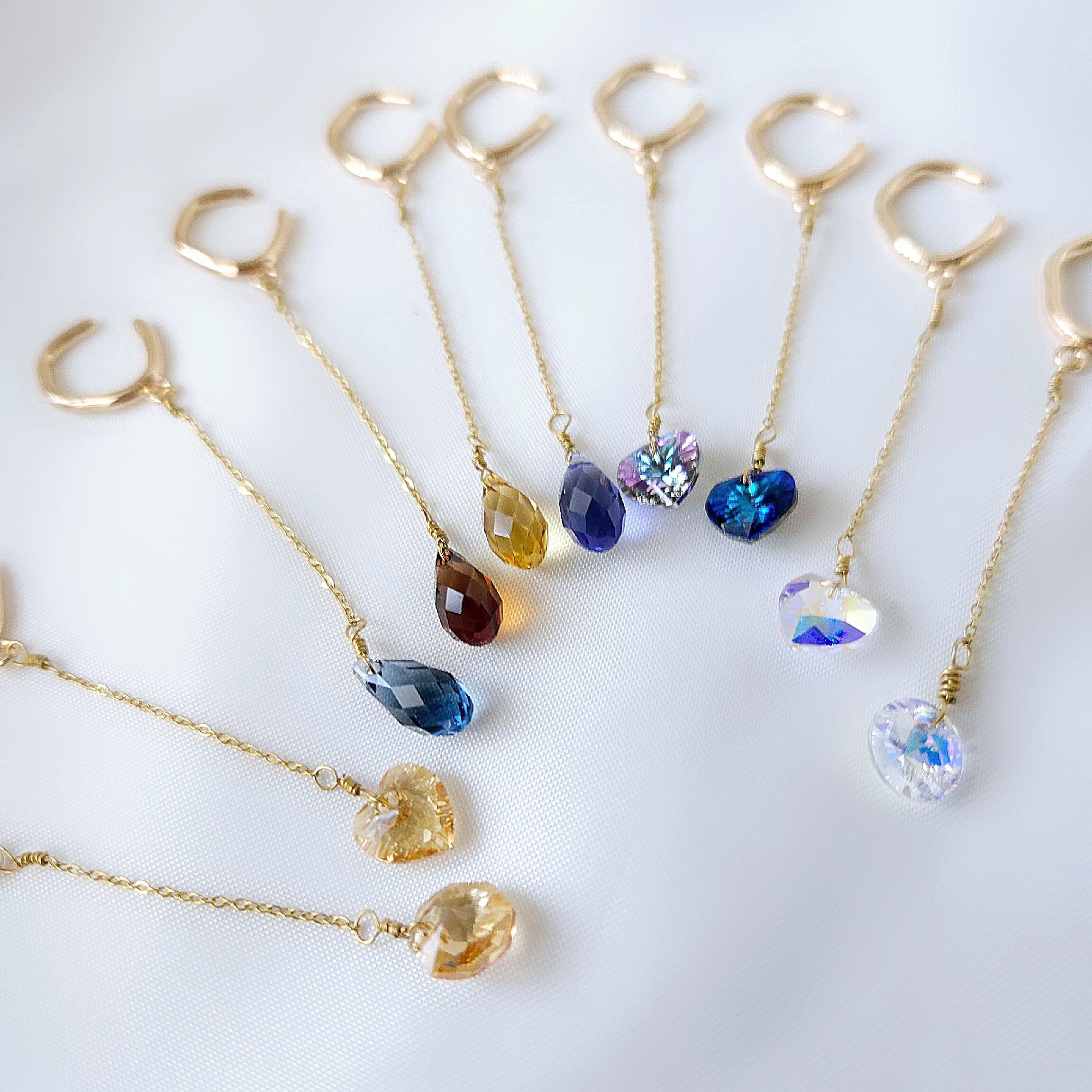 Night dancer サージカルステンレスとアドバンストクリスタルのイヤーカフ(ゴールドカラー)