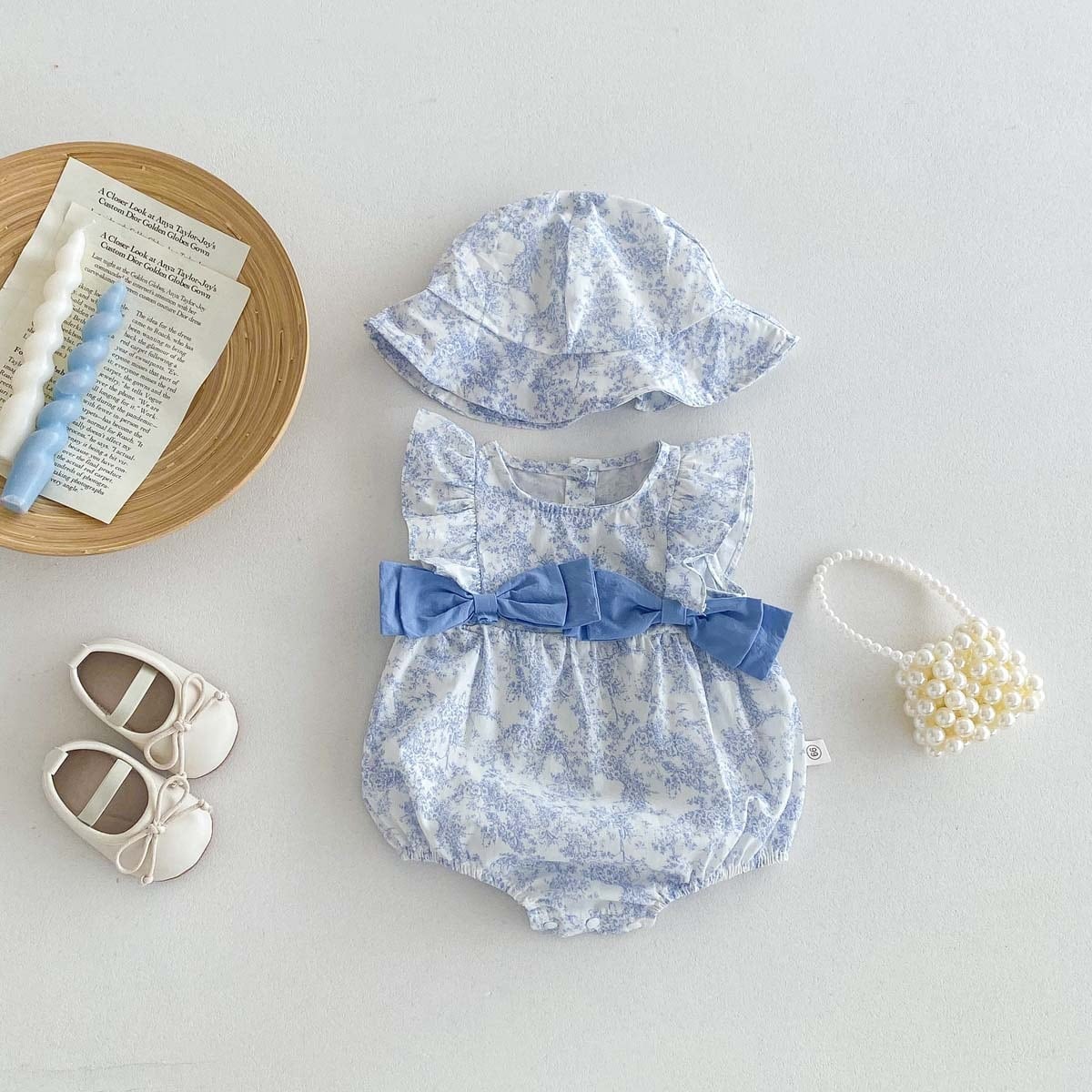 BABY】帽子付きリボン花柄ロンパース | 韓国子供服通販 - Baker