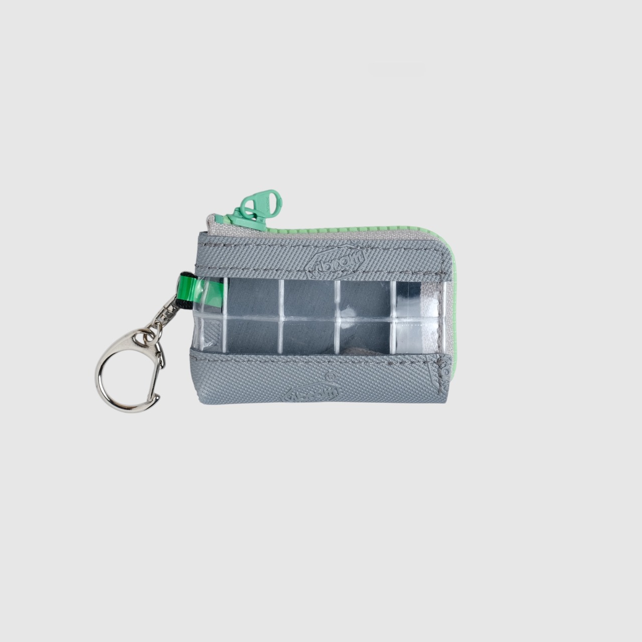 vibram coin pouch keychain (silver×clear) with green glowing zip