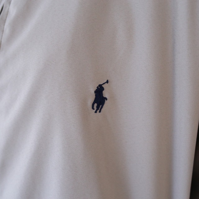 "Polo by Ralph Lauren" over silhouette drizzler jacket