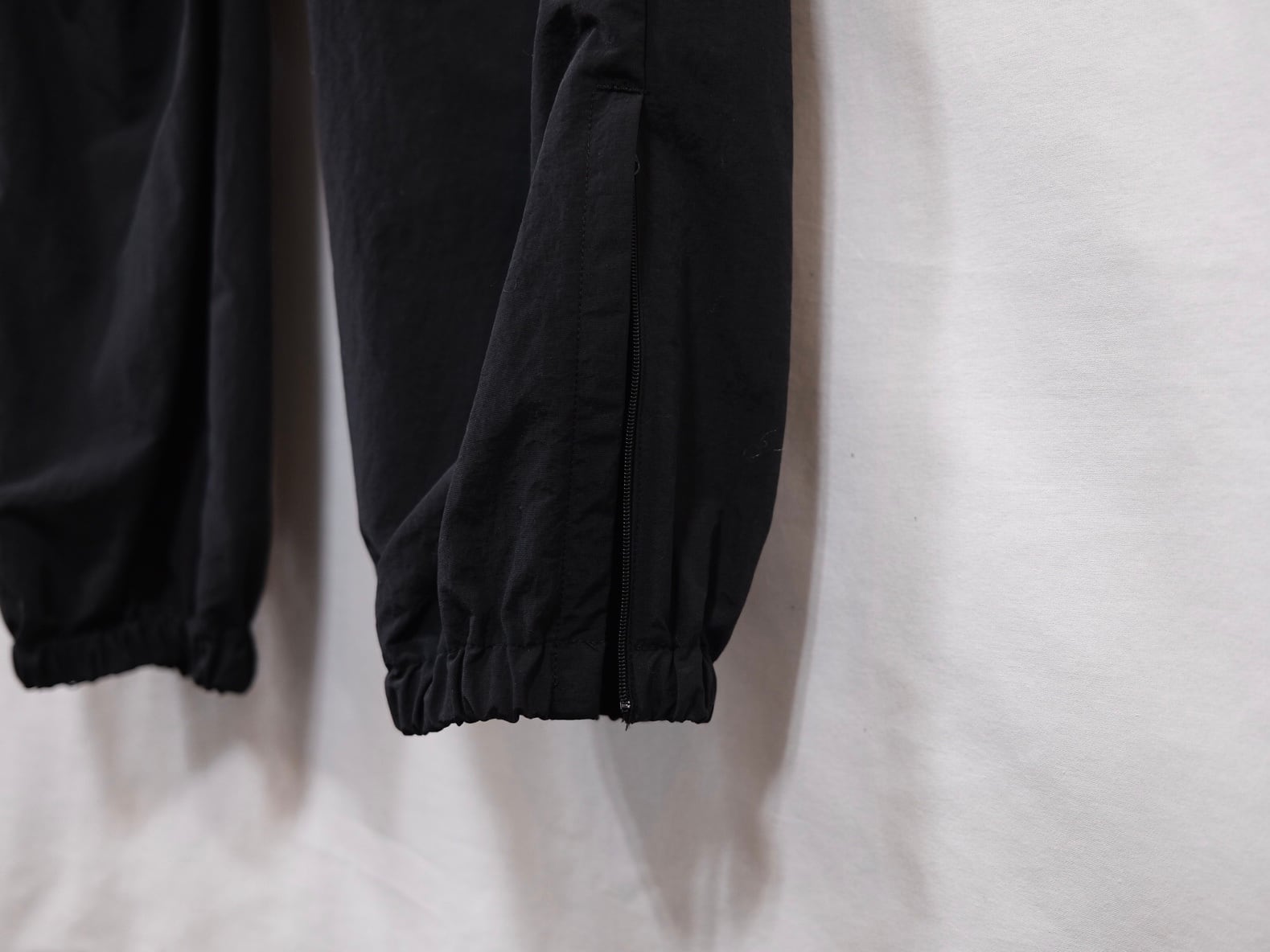 UNIVERSAL PRODUCTS.” NYLON SHELL TRACK PANTS BLACK” | Lapel online