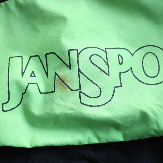 "JANSPORT" black × green sleeve logo printed over silhouette anorak parka