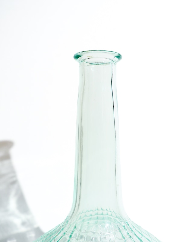 A glass vase resembling a spiderweb