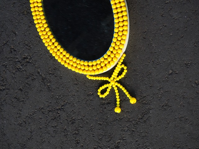 Yellow beaded oval wall mirror
