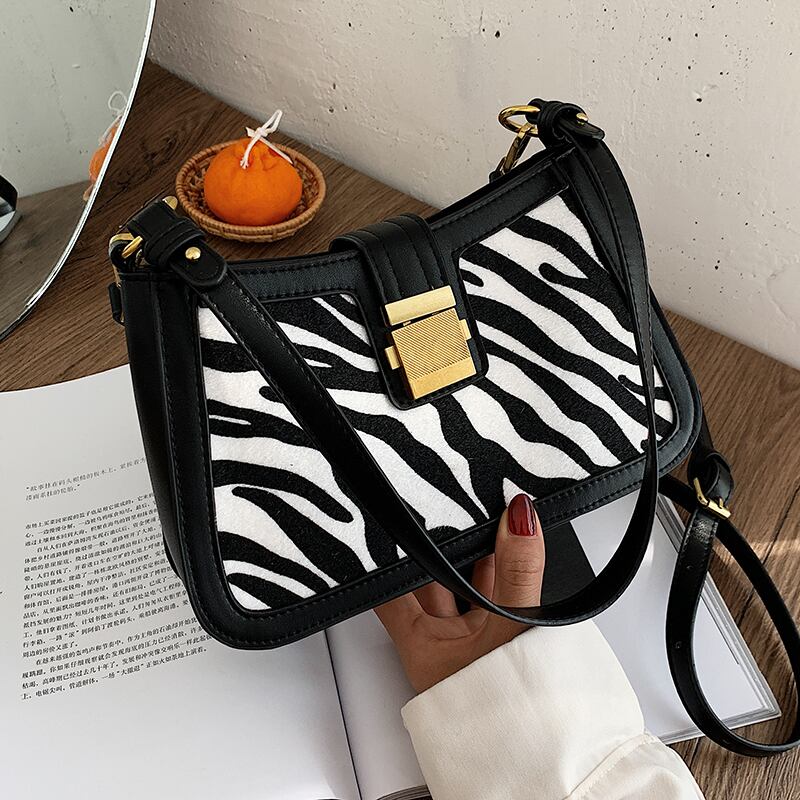 今年人気の女性用ワンショルダー脇の下小袋、女性用バッグ、2020年の新しい流行のファッションネットレッドオールマッチメッセンジャーバッグ Tiancai_Wing_Bag57224903313