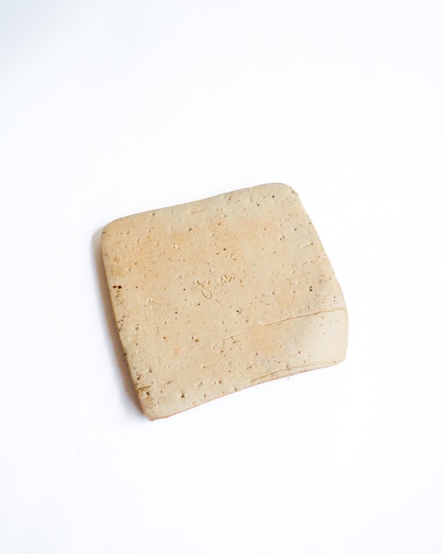 Ochre-colored hand-painted ceramic trinket tray
