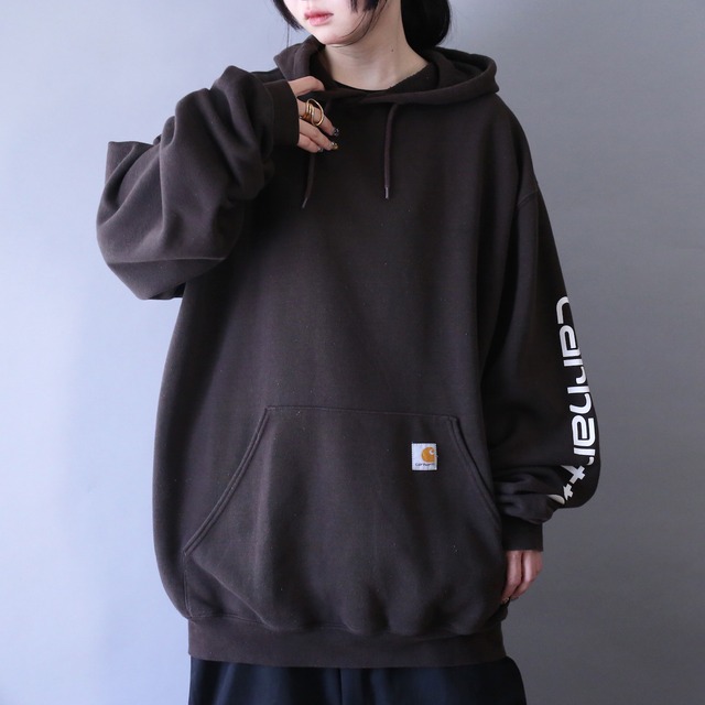 "carhartt" sleeve printed design over silhouette brown parka