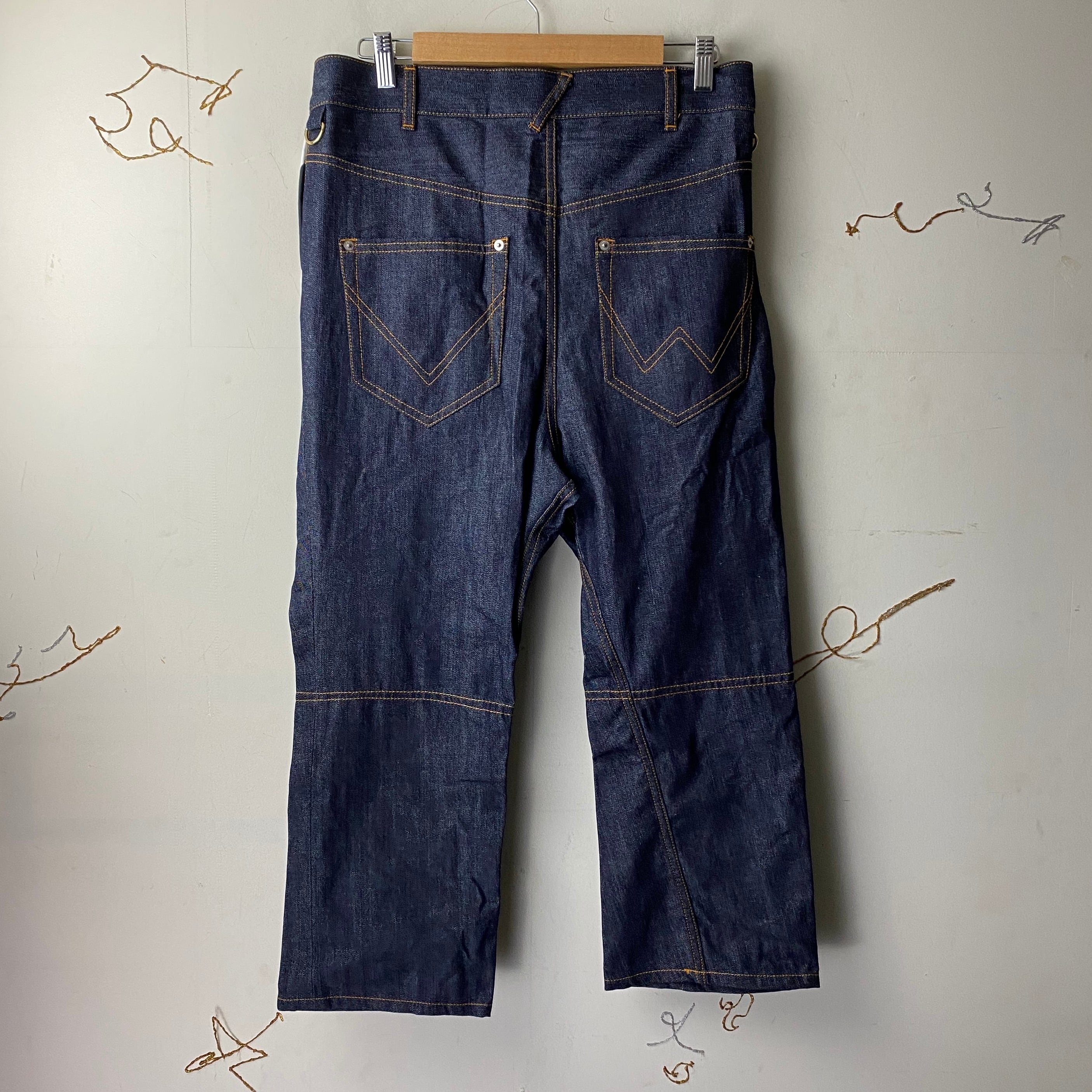 VIVIENNE WESTWOOD MAN asymmetric denim pants | NOIR ONLINE