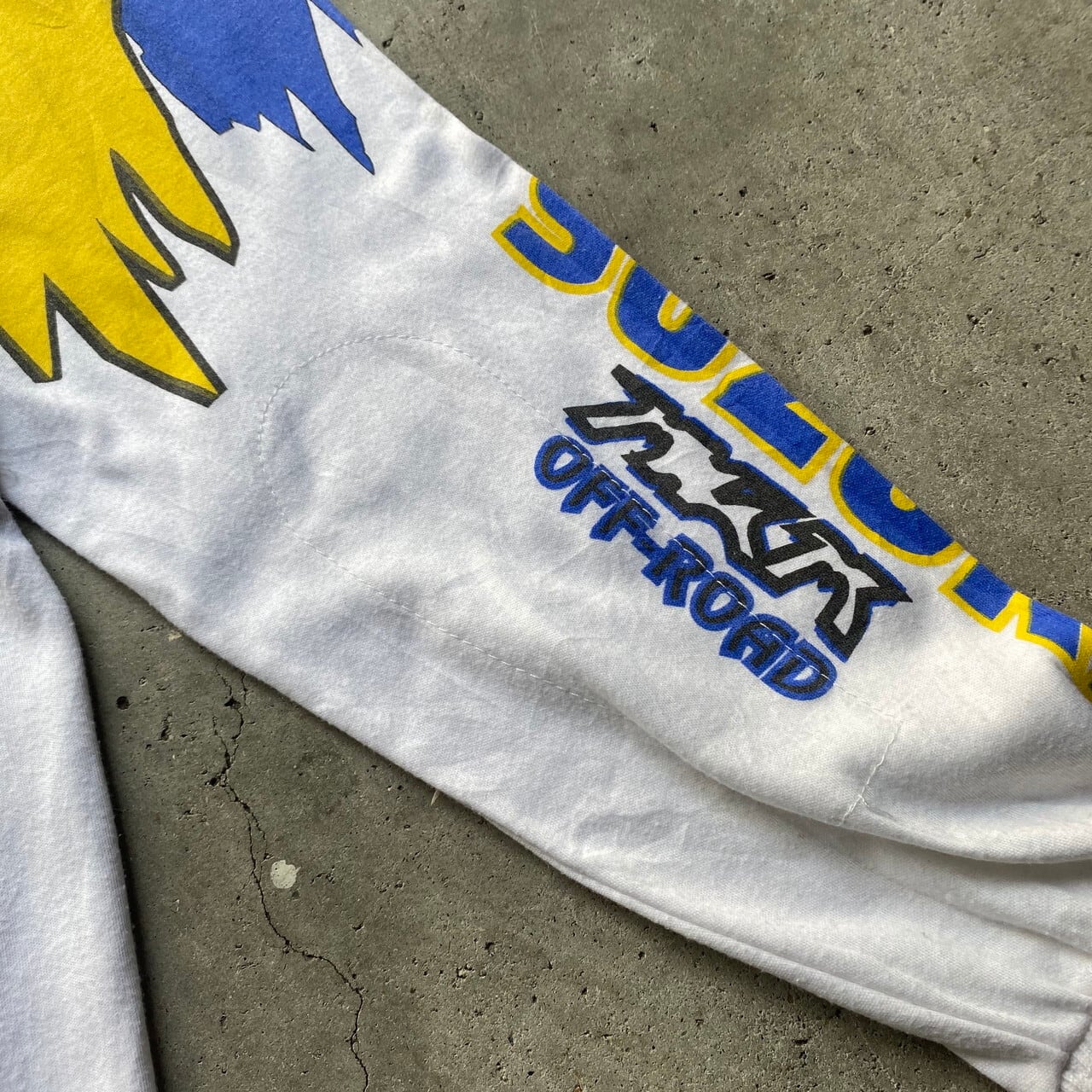 80年代 80s SUZUKI スズキ USA ロゴ プリント モトクロス レーシング ロングTシャツ バイク モーターサイクルTシャツ ヴィンテージ  ビンテージ 袖プリ エルボーパッチ モックネック メンズL 古着【ロングＴシャツ】 | cave 古着屋【公式】古着通販サイト