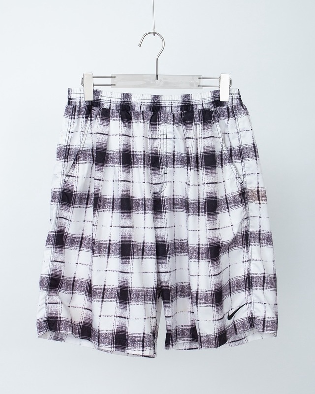 "NIKE" shadow check pattern baggy silhouette nylon easy short trousers