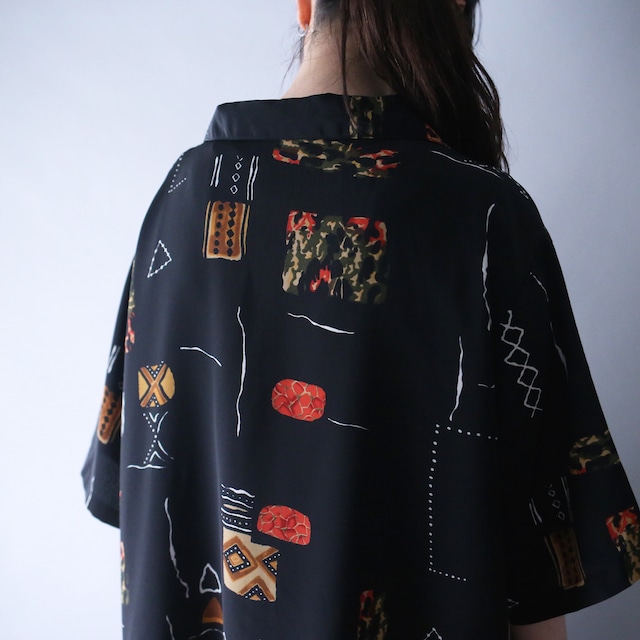 geometry art graphic pattern XXX over silhouette open collar h/s shirt