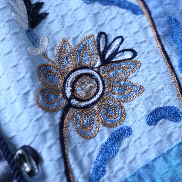 beautiful blue color flower embroidery design over silhouette gobelins jacket