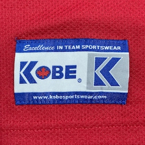 【KOBE SPORTSWEAR】カナダ製 メッシュ 九分丈 極太アーム アイスホッケー プリント アーチロゴ バックプリント トレーニングシャツ アドバタイジング MADE IN CANADA L US古着