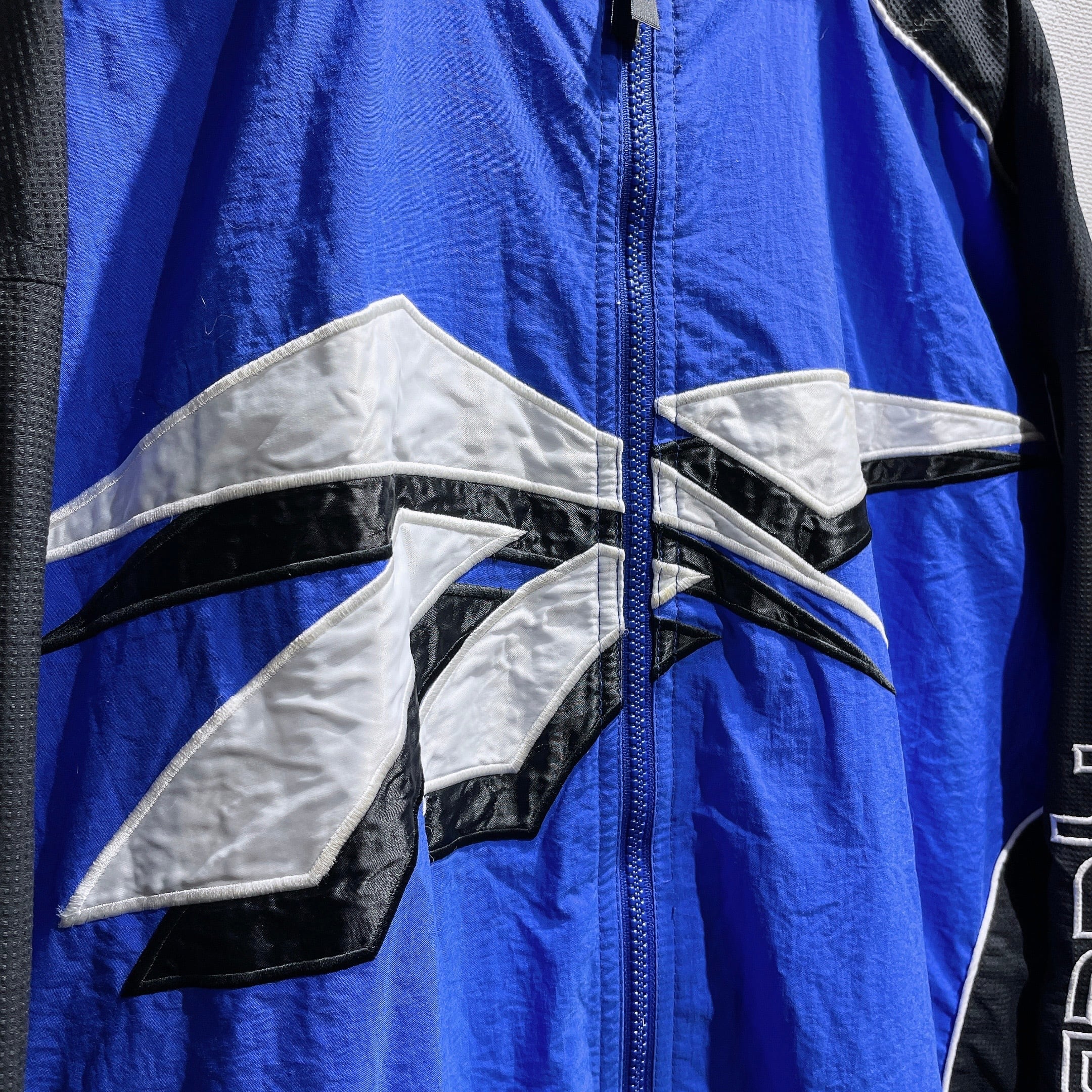 1990s ” Old Reebok ” Big vector logo Embbossed vintage Track jacket
