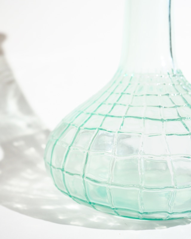 A glass vase resembling a spiderweb