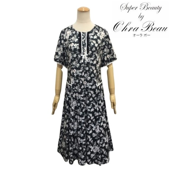 スーパービューティー ワンピース 胸元フリル 花柄 半袖ワンピ 2516028 ブラック 2025年春夏 オーラボー 大人かわいい服 大人スタイル キレイメ Super Beauty レディース アパレル 女性 M L LL 30代 40代 50代 60代