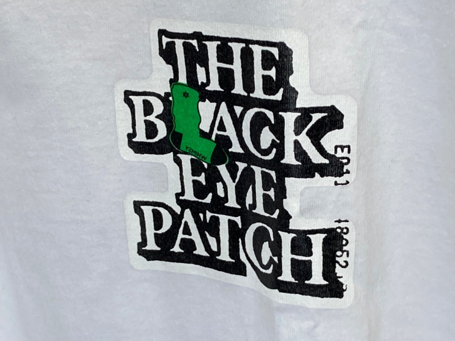 Black eye patch × whimsy  tシャツ