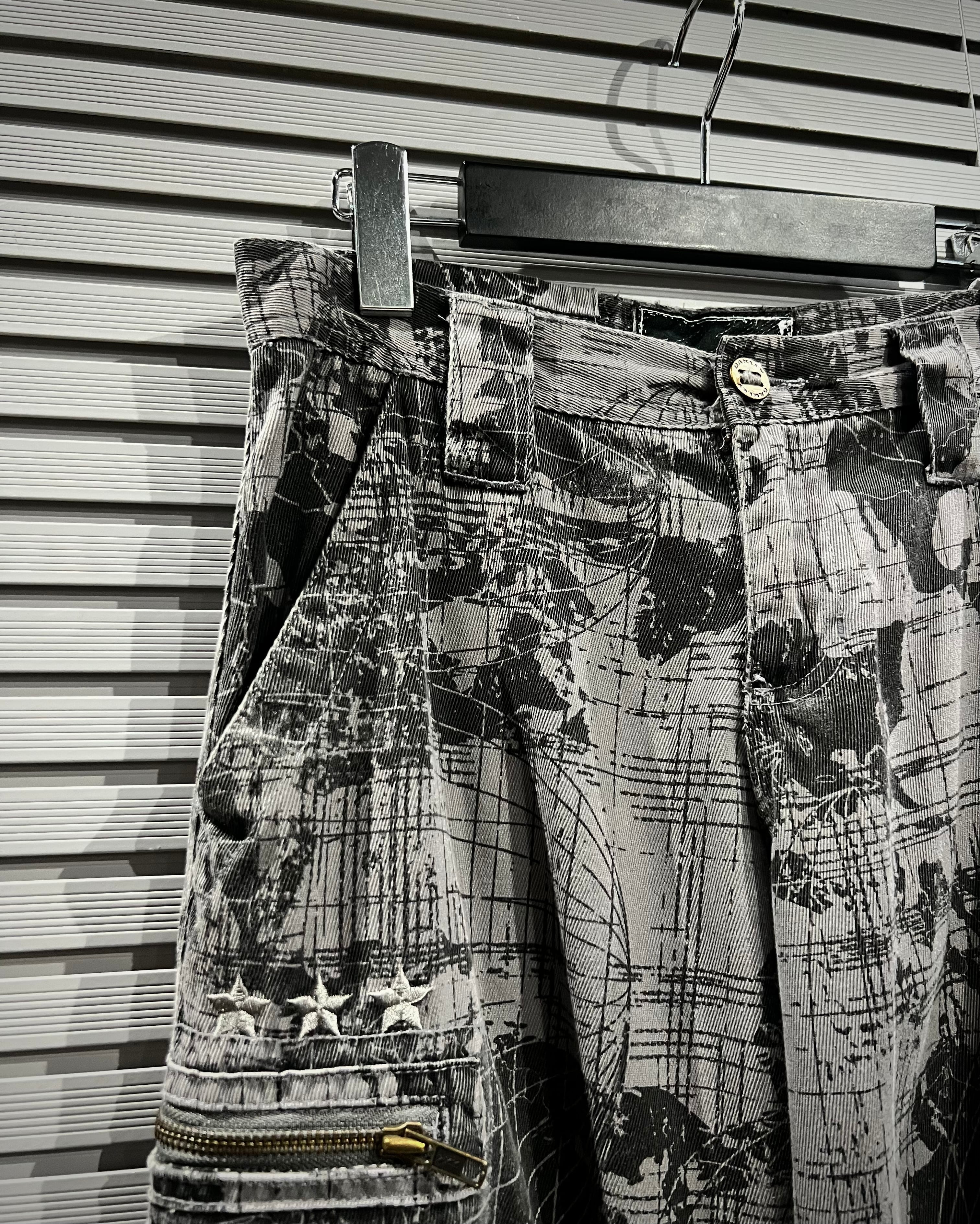 90s OAKLEY 総柄 グラフィック ナイロン カーゴ イージーパンツ 極太 X VINTAGE】“OAKLEY” Total Pattern Loose Cargo Pants | Caka(カカ